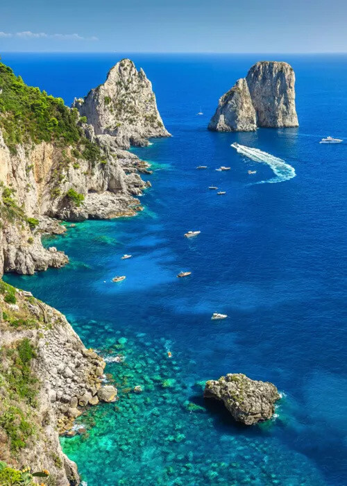 Dramatic sea stacks rising from the coastline of Southern Italy