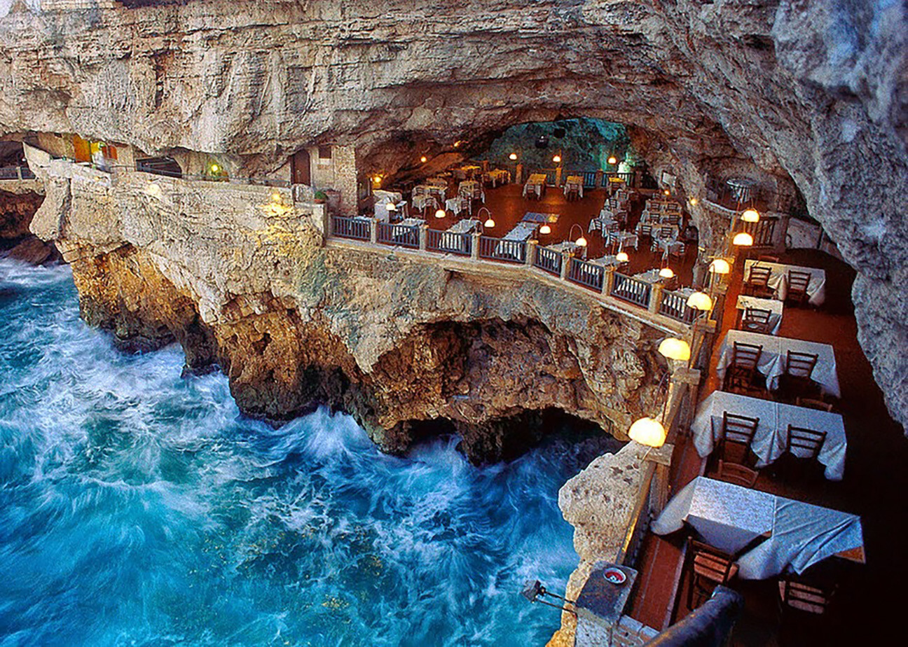 Restaurant built inside a sea cave on the cliffs of Polignano a Mare