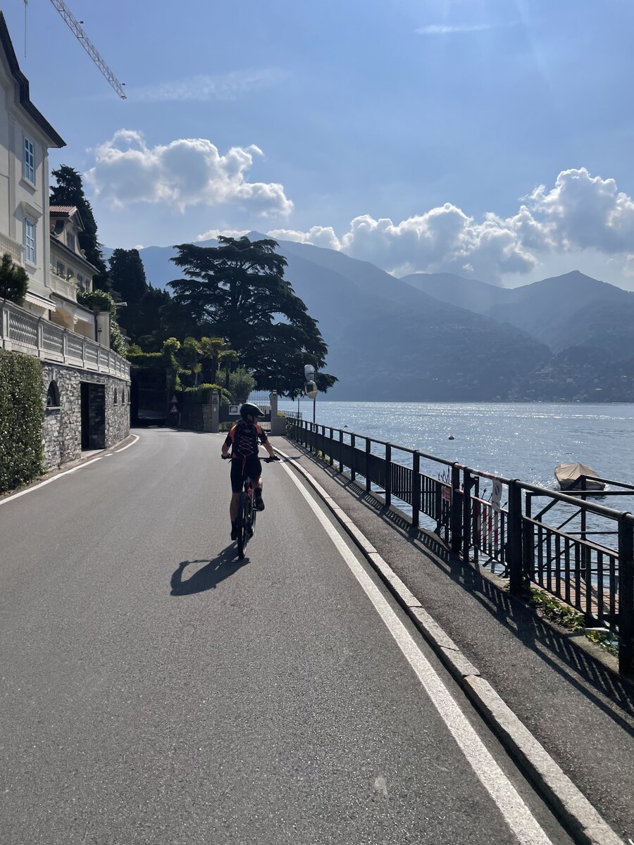 Woman riding an e-bike enjoying a view of Lake Como