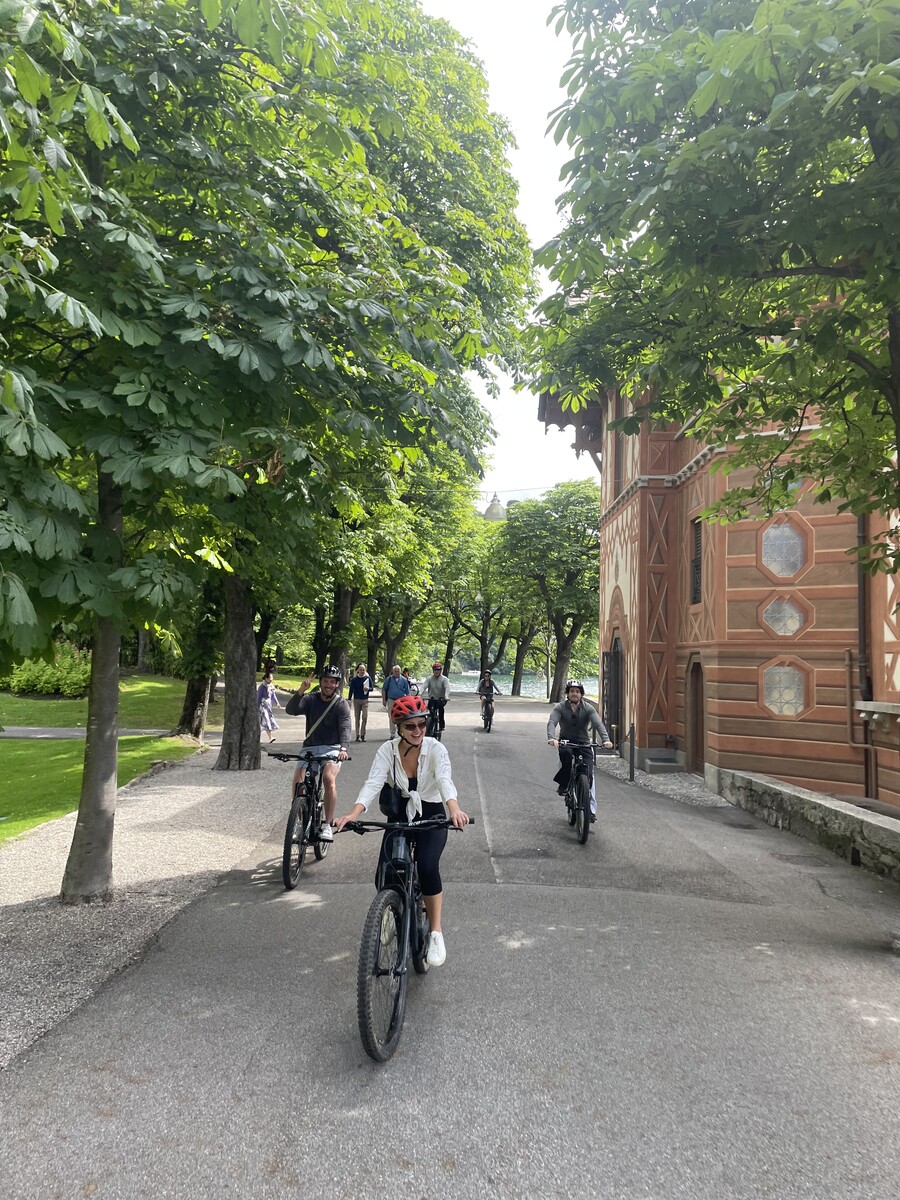 Group of cyclists riding near Villa d'Este in Cernobbio