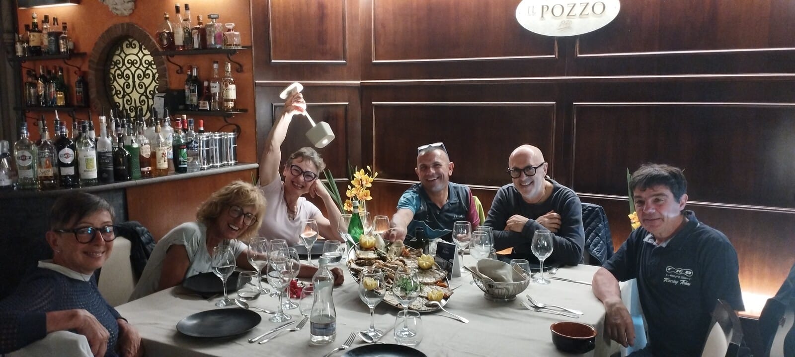 Group dinner celebrating the day's ride in Sicily