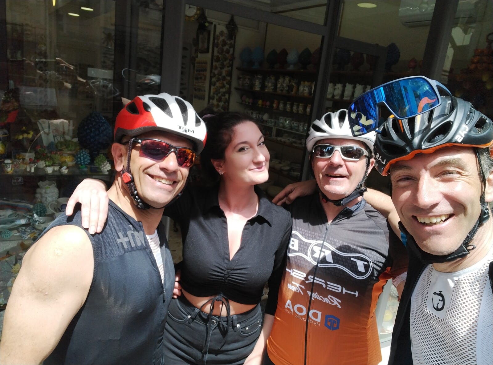 Group photo inside a local bike shop during the tour