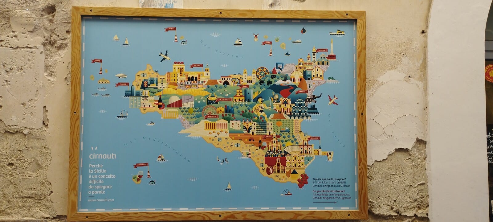 Illustrated map of Sicily displayed on a wall