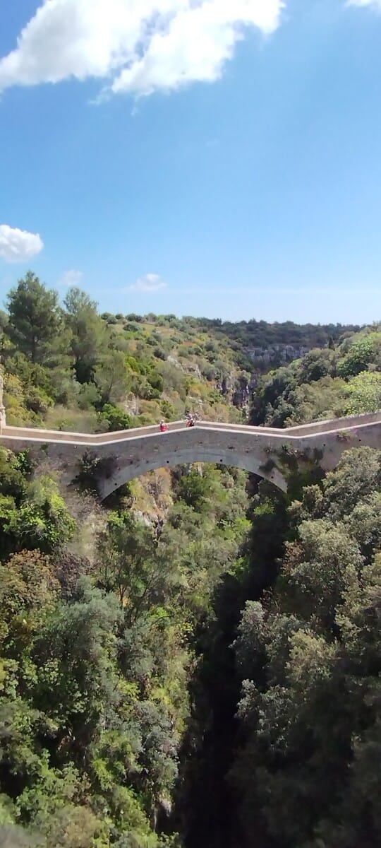 Stone bridge crossing a canyon in the Sicilian countryside