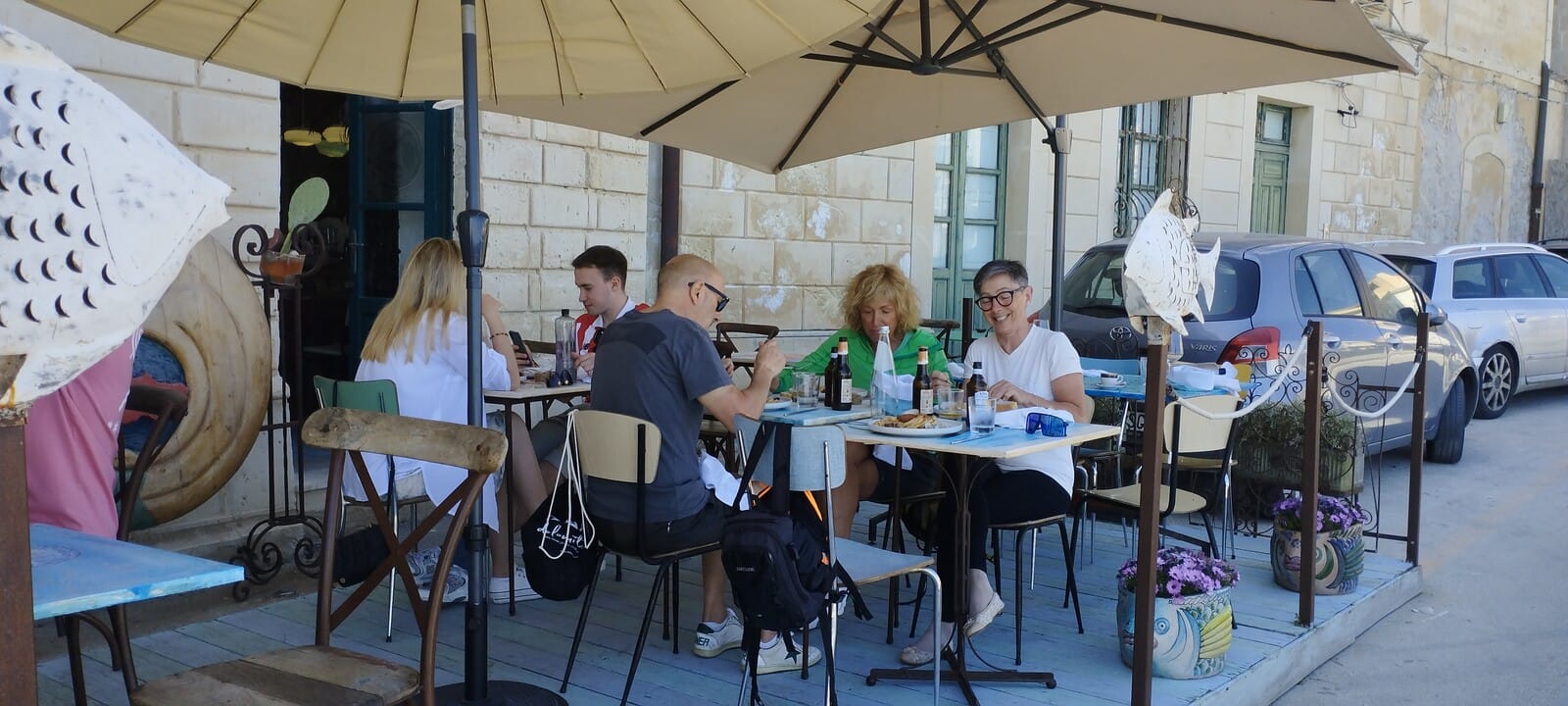 Group enjoying an outdoor lunch during the Sicily cycling week