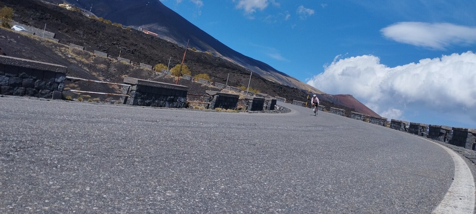 Road winding through the volcanic landscape of Mount Etna