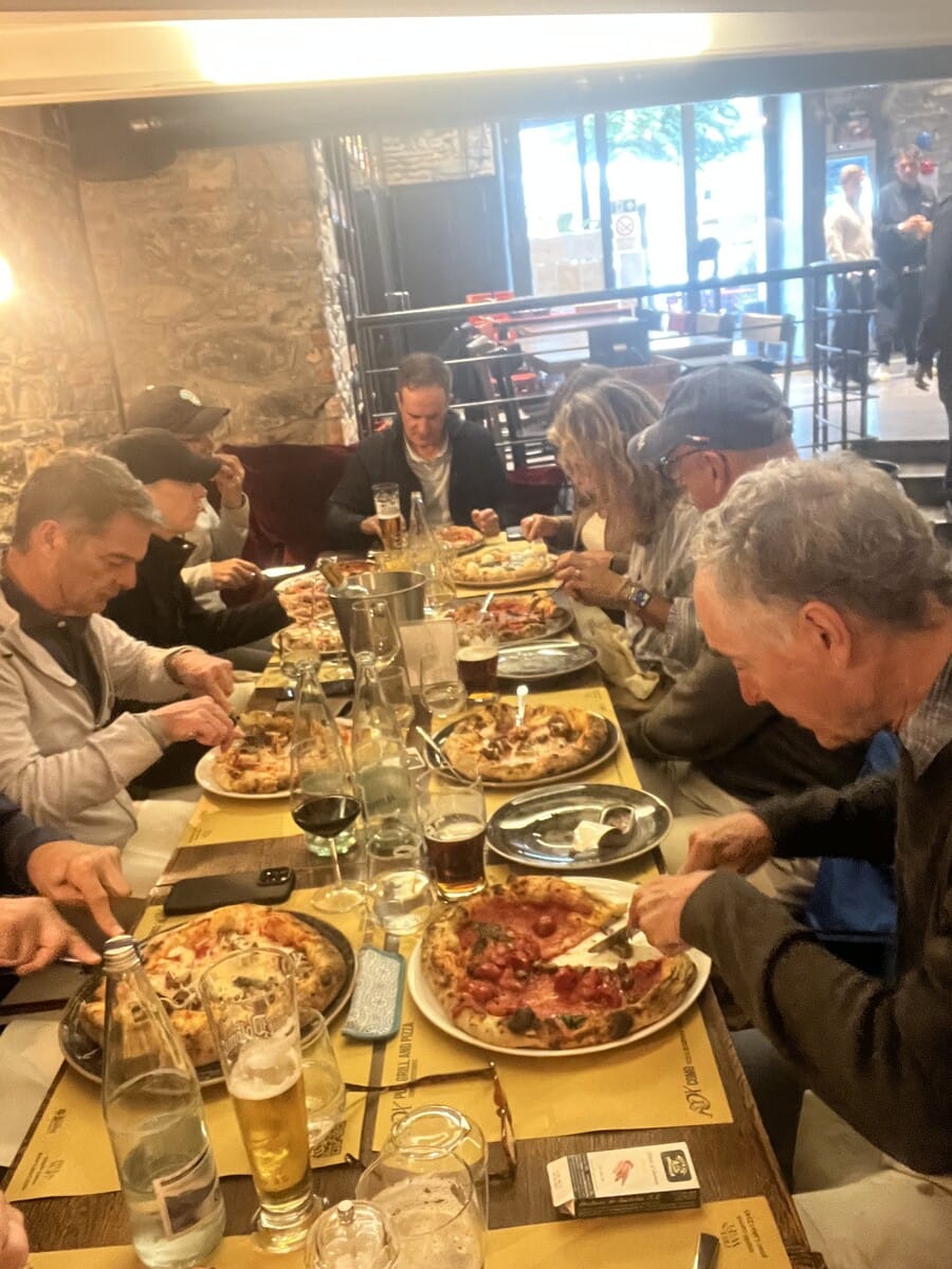 Group pizza dinner during the Como-Valtellina cycling week
