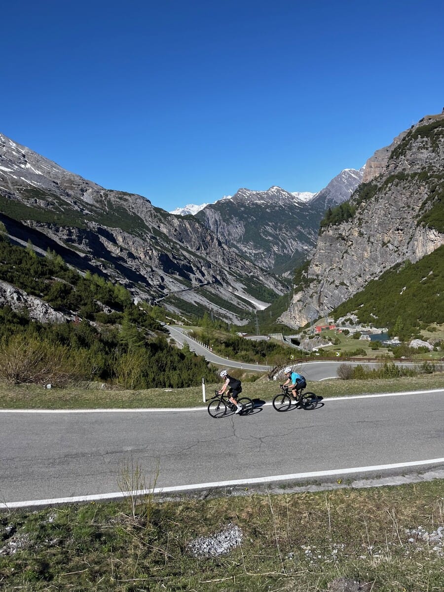 Cyclists riding the road up the legendary Stelvio Pass