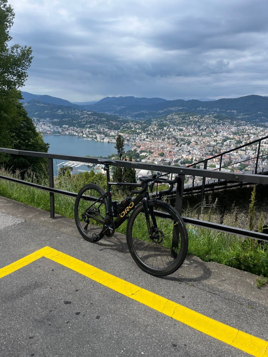 Bikes parked at a scenic viewpoint above the lake at Monte Bré